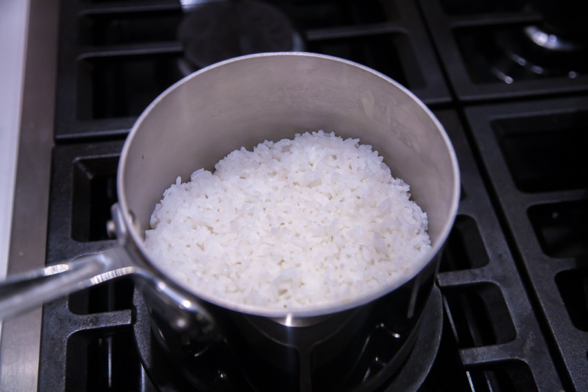 When cooking rice on the stovetop, should the lid be left on or